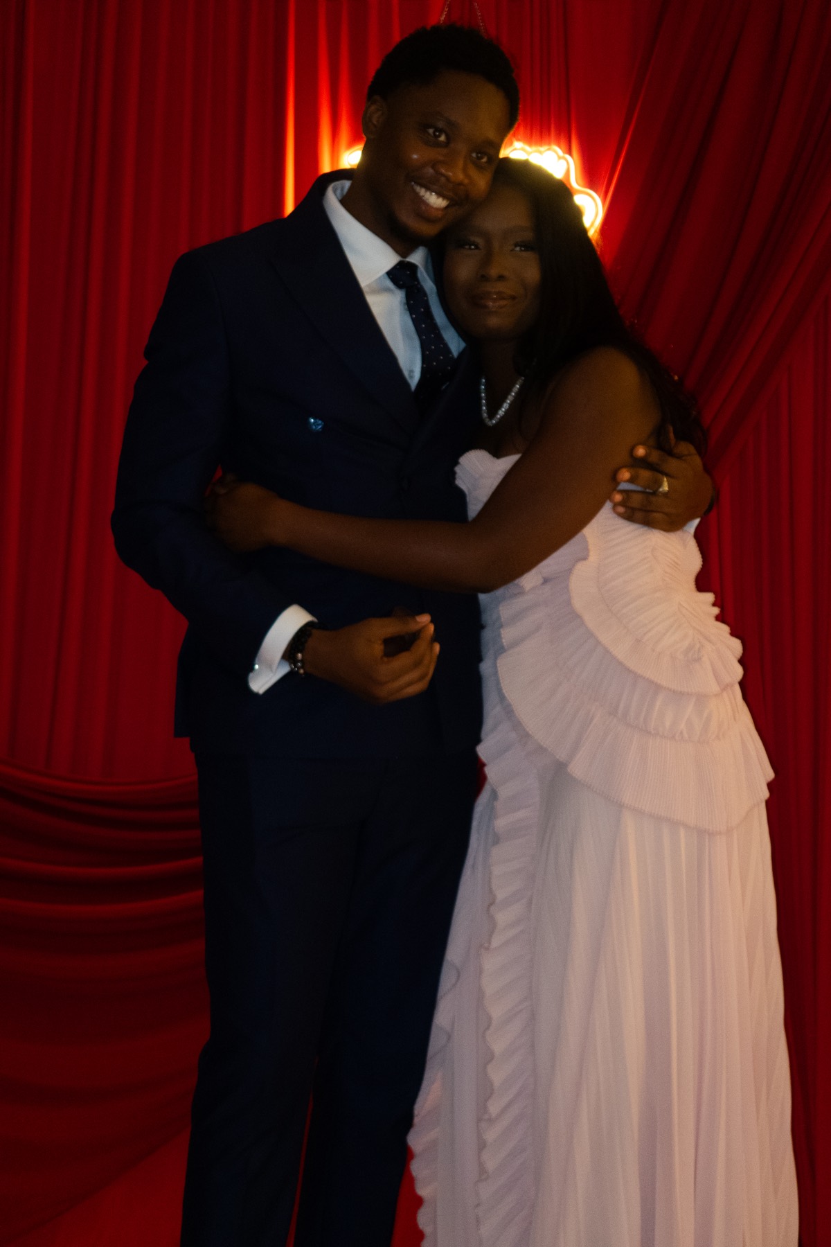 Mosope and Ibukun holding each other